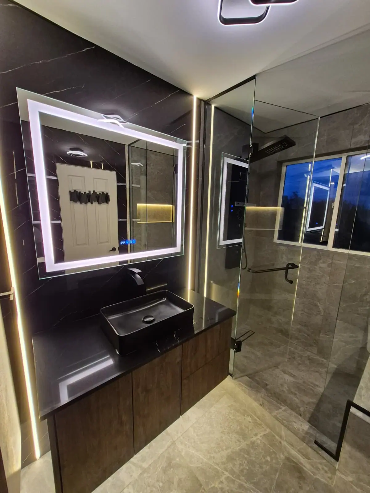 Shower with backlit niche, LED mirror and dark vanity