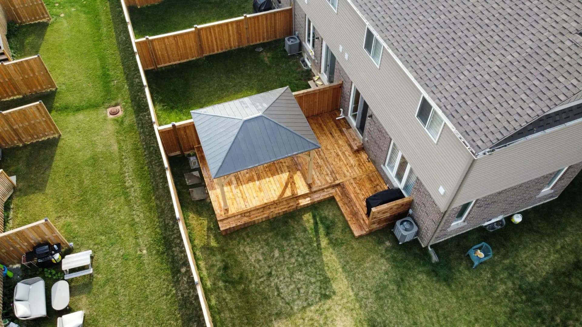 Aerial view of a backyard deck with gazebo