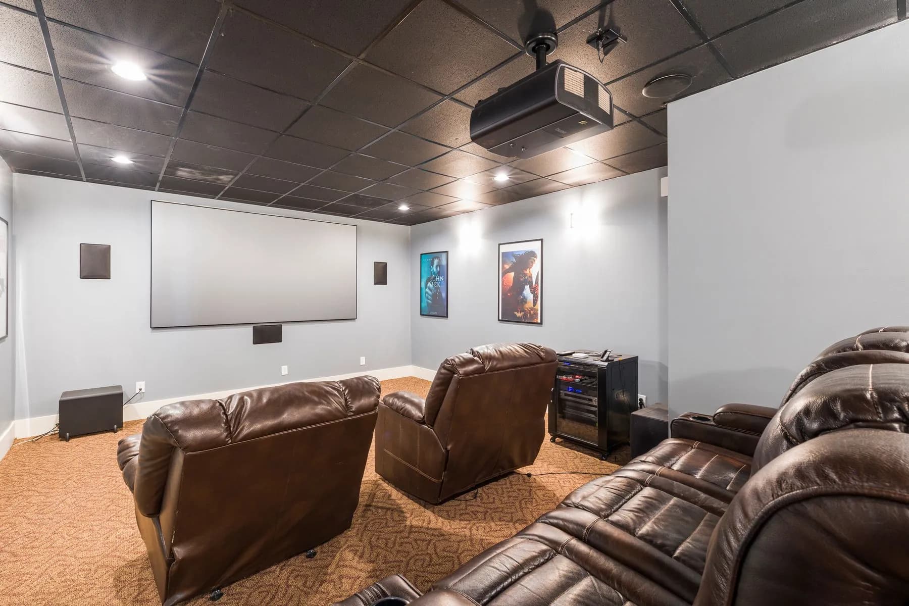 Home cinema with recliners projector and screen